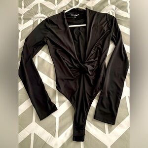 Women’s small black bodysuit. Plunging neckline.